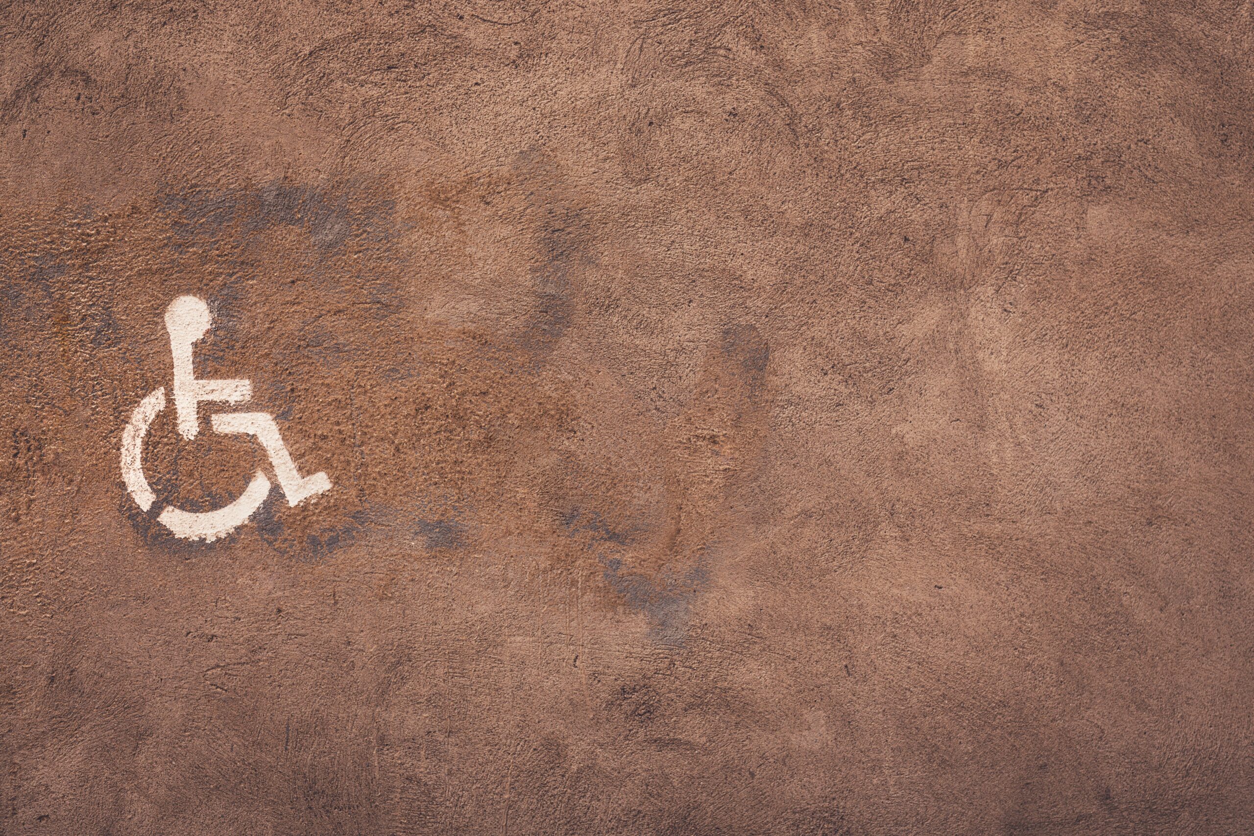 Accessibility logo printed on a wall